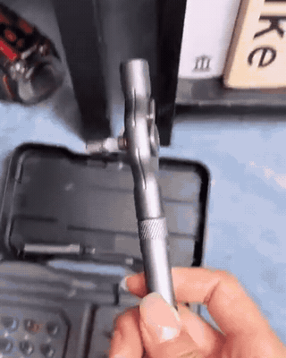 Handheld owner clip ratcheting a cabinet screw inside a 2-inch bookshelf gap with one finger
