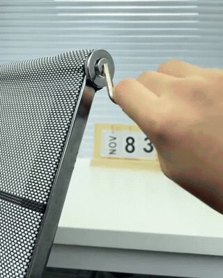 Owner handheld clip comparing a mini Allen key vs the AXVANE T-handle on an office chair armrest