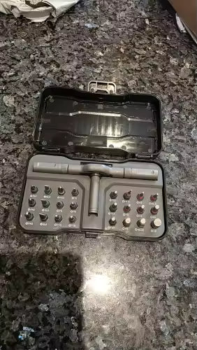 Open RS1 24-in-1 ratchet kit on dark granite countertop